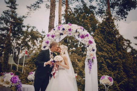 charming wedding elegant couples in elegant summer dress and wonderful weatherの写真素材