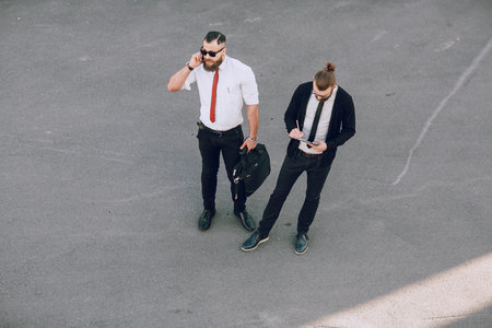 business man checking objects in glasses shirtの写真素材