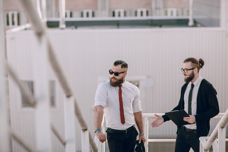 business man checking objects in glasses shirtの写真素材