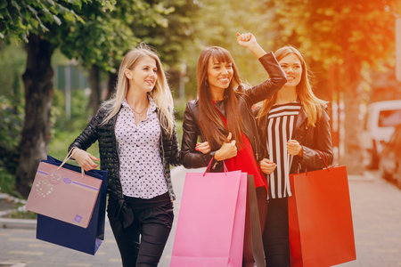 woman with returns from shopping with colored bags fashion