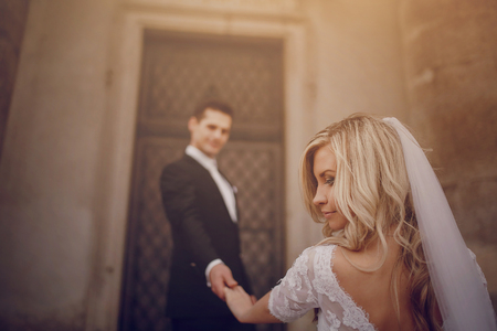 wedding day young couple with a brilliant golden autumnの写真素材