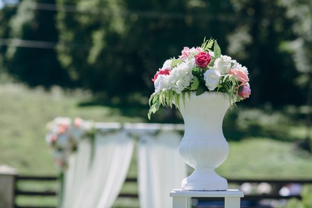 Beautiful wedding decorations for the ceremony outside in sunny weatherの写真素材