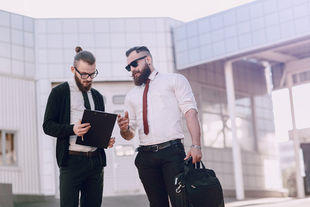 business man checking objects in glasses shirtの写真素材