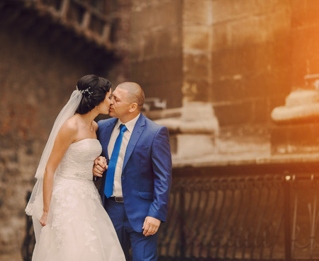 beautiful young couple in wedding sunny summer dayの写真素材