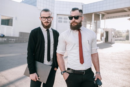 business man checking objects in glasses shirtの写真素材