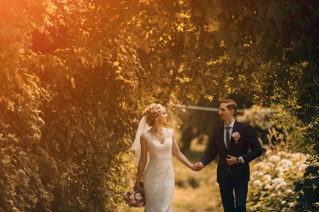 lovely blond summer wedding couple in sunny weatherの写真素材