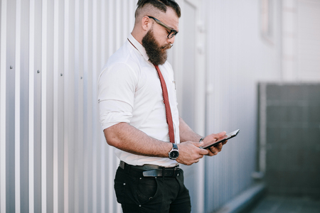 business man checking objects in glasses shirtの写真素材