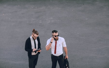business man checking objects in glasses shirtの写真素材