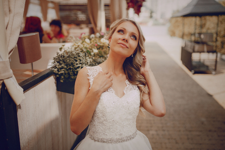 wedding couple sitting in a cafe on their wedding dayの写真素材