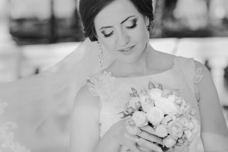 beautiful wedding couple on their wedding walking in the park in excellent weather conditionsの写真素材