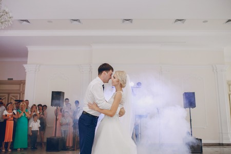 first dance of a young couple in a romantic restaurantの写真素材