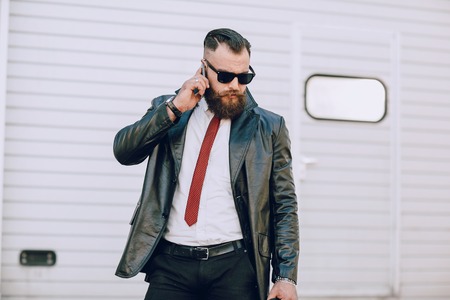 business man checking objects in glasses shirtの写真素材