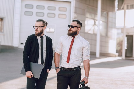 business man checking objects in glasses shirtの写真素材