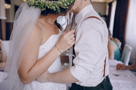 wedding couple in a restaurant celebrating her wedding dayの写真素材