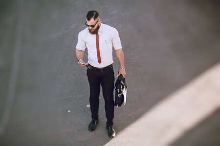 business man checking objects in glasses shirtの写真素材