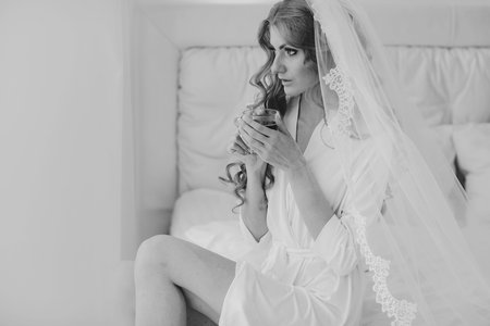 beautiful blonde bride enjoys her wedding day in the summerの写真素材