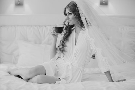 beautiful blonde bride enjoys her wedding day in the summerの写真素材