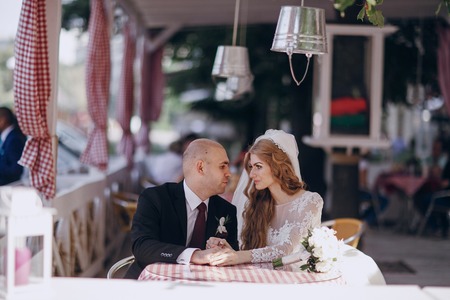 beautiful blonde bride enjoys her wedding day in the summerの写真素材