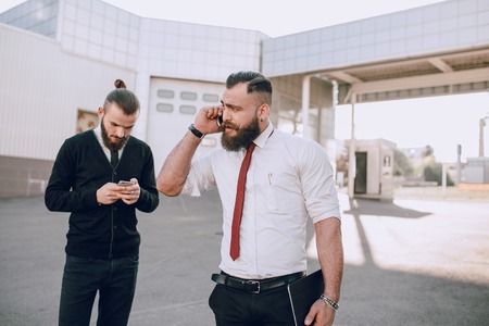 business man checking objects in glasses shirtの写真素材