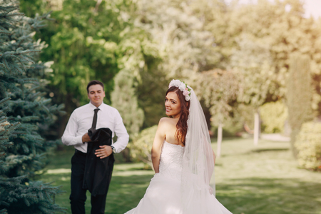 gorgeous wedding and beautiful couple of young people in the summerの写真素材