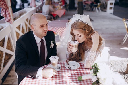 beautiful blonde bride enjoys her wedding day in the summerの写真素材
