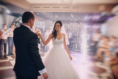 a wonderful pair of dancing at your wedding in a restaurantの写真素材