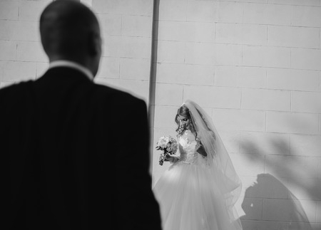 beautiful blonde bride enjoys her wedding day in the summerの写真素材