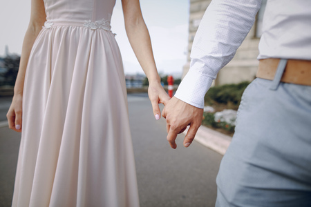 gorgeous wedding couple walking into their wedding day in Budapestの写真素材