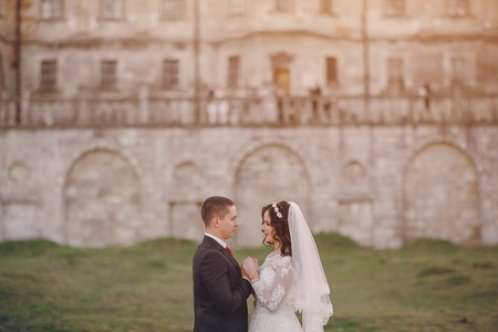 beautiful wedding couple celebrating their wedding day in autumnの写真素材