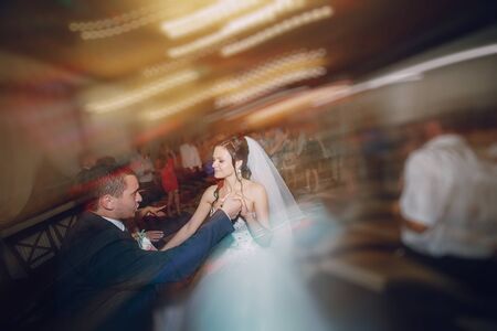 a wonderful pair of dancing at your wedding in a restaurantの写真素材