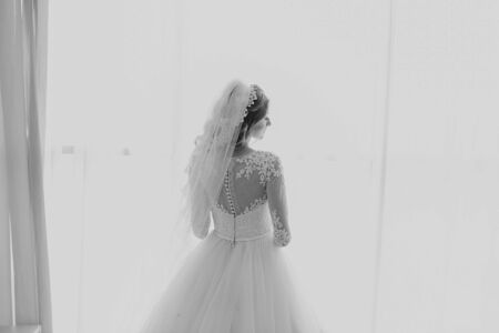 beautiful blonde bride enjoys her wedding day in the summerの写真素材