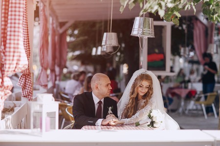 beautiful blonde bride enjoys her wedding day in the summerの写真素材