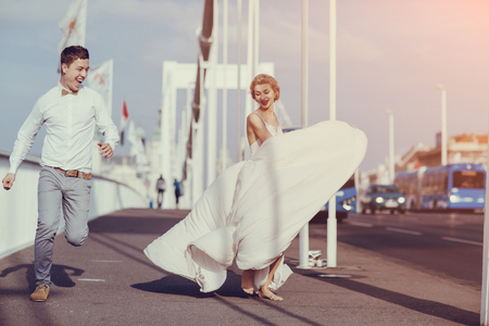 gorgeous wedding couple walking in the old city of Budapestの写真素材