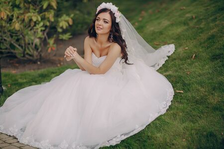 gorgeous wedding and beautiful couple of young people in the summerの写真素材