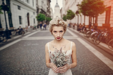 gymnastics the bride posing on the street in Budapestの写真素材