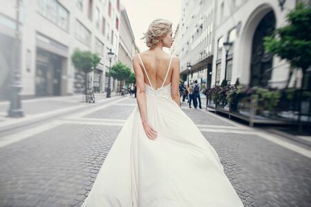 gymnastics the bride posing on the street in Budapestの写真素材