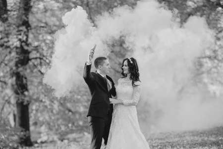 beautiful wedding couple celebrating their wedding day in autumnの写真素材