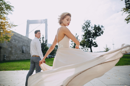 gorgeous wedding couple walking in the old city of Budapestの写真素材