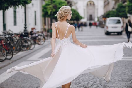 gymnastics the bride posing on the street in Budapestの写真素材