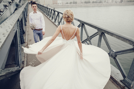 beautiful unique couple walks into your wedding day in Budapestの写真素材