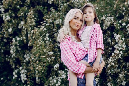 mom and daughter walk in the Park shirtsの写真素材