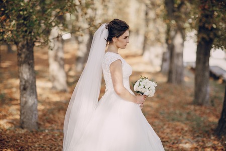 a wonderful autumn wedding beautiful happy coupleの写真素材
