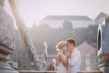 gorgeous wedding couple walking in the old city of Budapestの写真素材