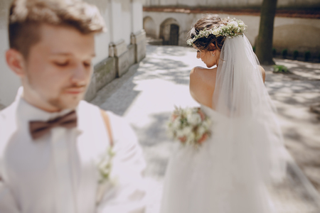 lovely wedding couple oditi a crown of butterflies and suspendersの写真素材