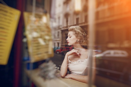 a wonderful couple celebrating in a cafe on her wedding dayの写真素材