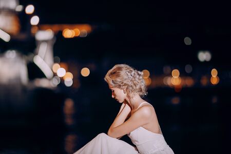 gorgeous wedding couple walking in Budapest at nightの写真素材