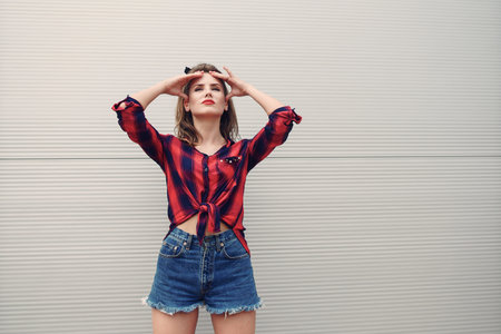 beautiful girl, brightly dressed in the style of pin-up walks in with glasses