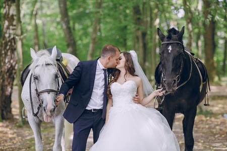 couple with horsesの写真素材