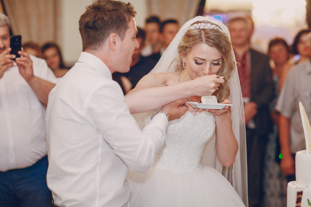 cutting the wedding cakeの写真素材