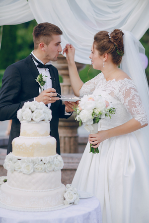 couple with wedding cakeの写真素材